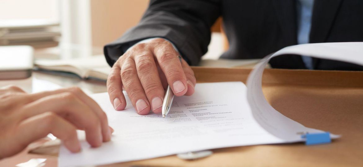 Business people signing a contract