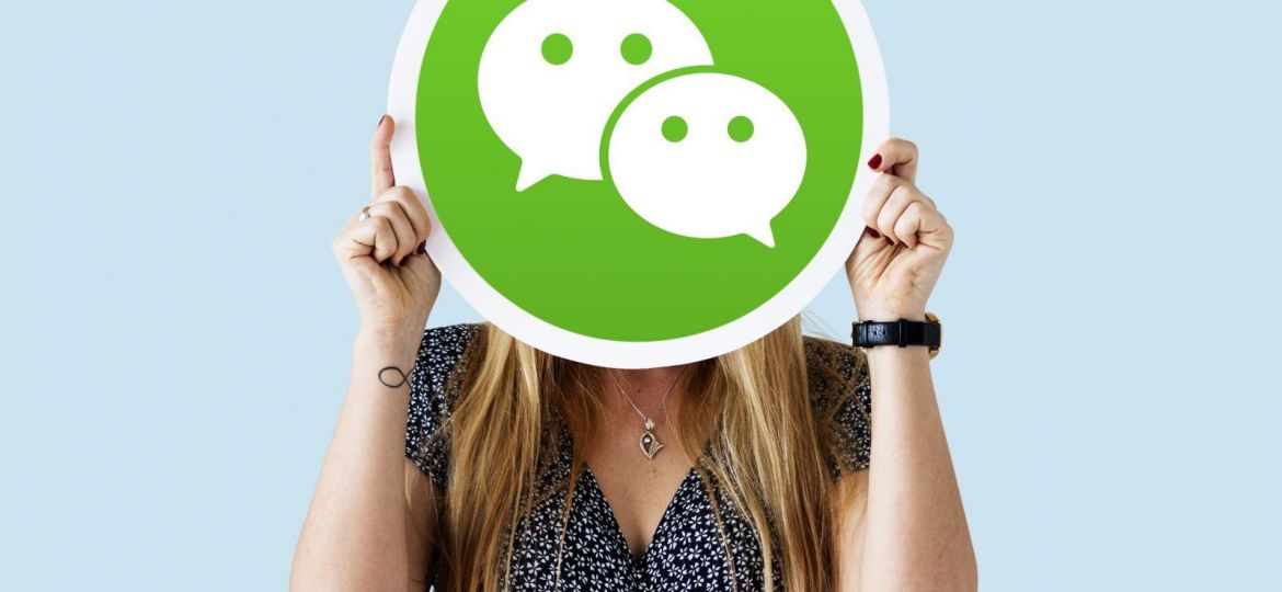 Woman holding a social network icon